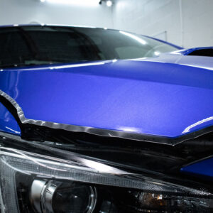ppf installation of blue subaru hood closeup