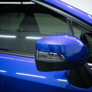 blue subaru car side mirror